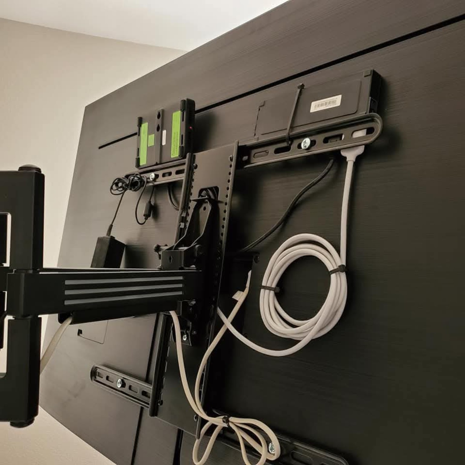 Behind the TV mounting and cabling