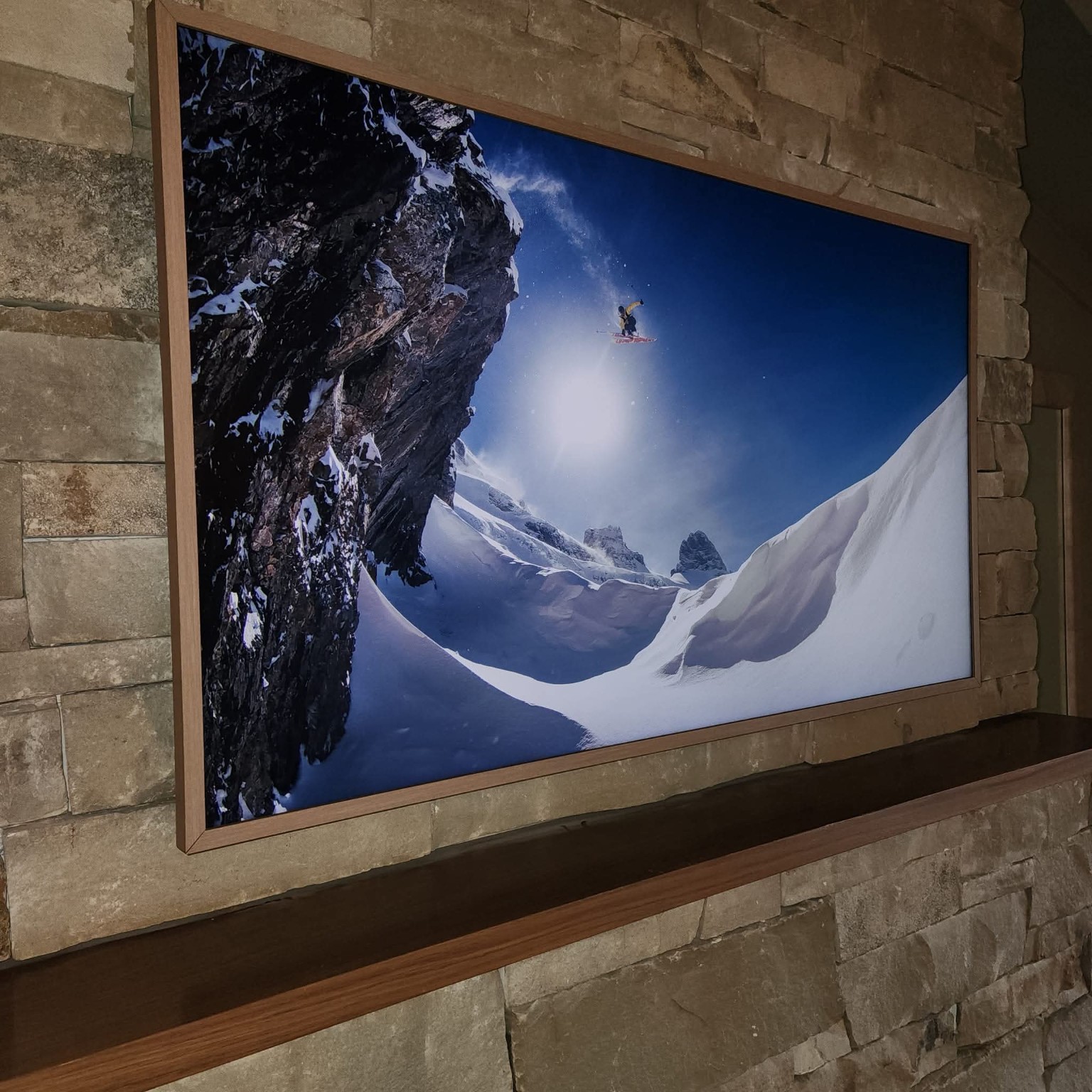 Television mounted on a stone wall